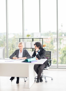 man-and-woman-sitting-at-the-table-3122277